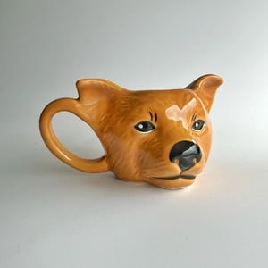 Caneca 3D Cachorro Caramelo Cêramica  Branco predominante  Esmalte brilhante Suporta líquidos quentes ou frios e pode ir ao microondas